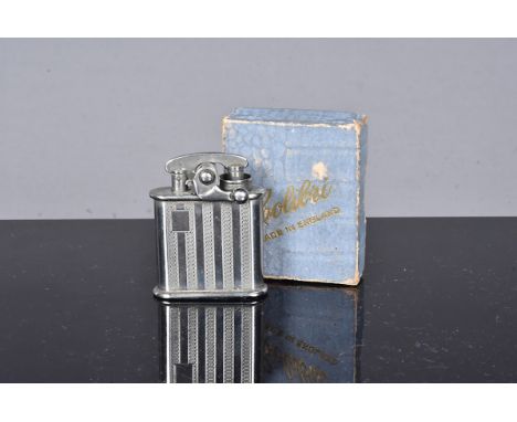 A Colibri Kickstart petrol pocket lighter, with silver plated finish, engine turned design, c1929, complete with original box