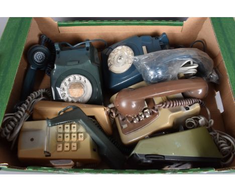 A collection of five vintage telephones, including rotary and push button examples, in various colours, blue, green, cream, g