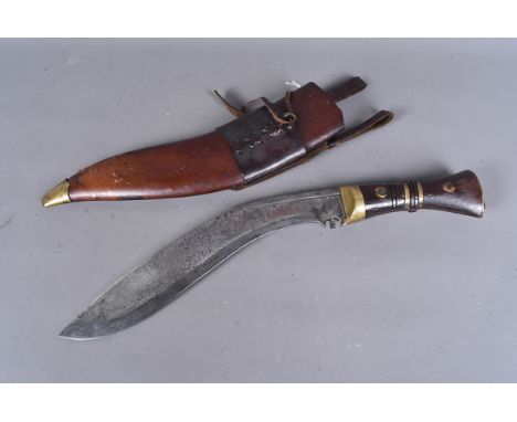 A Military marked Kukri, the blade dated 1917, also marked with a brad arrow and 37, possibly unit marked, complete with leat