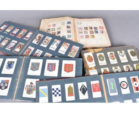 An assortment of cigareete card albums, comprisng&nbsp; various sets ans part sets, to include Lambert &amp; Butler Motorcycl