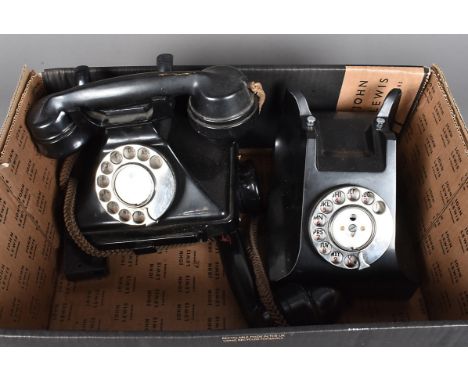 Two vintage black plastic rotary telephones, both with pull out note slides to the bottom, plus receivers (2)