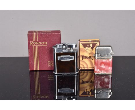A Thorens Bijou Original pocket lighter, with pint mottled celluloid wrap, in an original cardboard box of retail, together w
