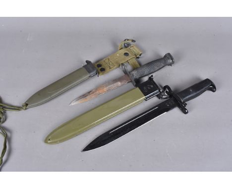 A WWII-period US bayonet and scabbard, possibly an M1, marked WT with date 1942, together with a an M7 bayonet and M8A1 scabb