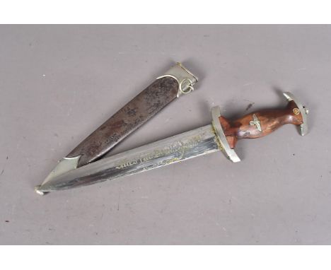 An early German SA dagger by Asso, with wooden handle with SA and eagle inlaid badges, white metal cross guard with NS stampe