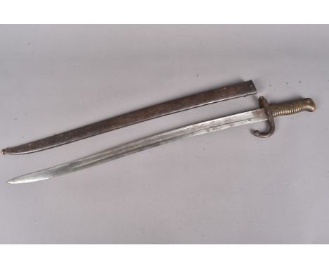 A French Yataghan bayonet and scabbard with matching numbers, dated 1872 to the spine of the blade, serial P 29045, to both t