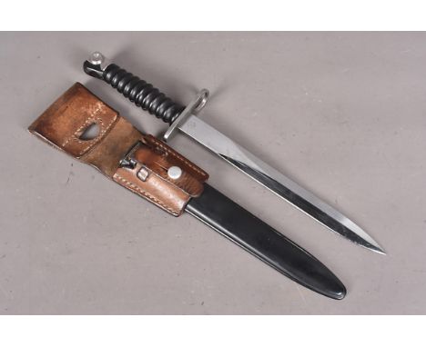 A Swiss Sig 57 bayonet and scabbard, maker's mark to blade, plus W672156, together with plastic scabbard and brown leather fr