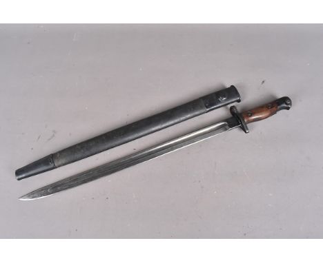 A British 1907 Pattern bayonet by Sanderson, dated 1918, single fullered 43cm long blade, complete with leather and steel sca