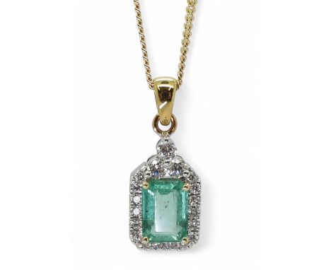 AN EMERALD PENDANT made in 18k yellow and white gold, the step cut emerald is approx 8mm x 5.8mm x 3.5mm, surrounded with est