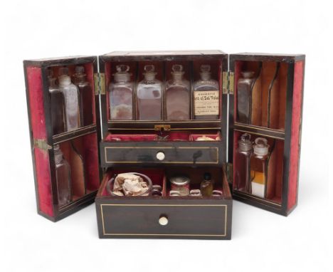 A 19TH CENTURY ROSEWOOD APOTHECARY TRAVELLING OR CAMPAIGN MEDICINE BOX inlaid with mother of pearl decoration, the two doors 