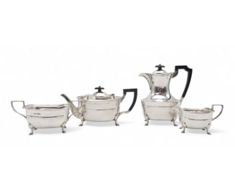 A GEORGE V FOUR PIECE SILVER TEA SERVICE by Lawson &amp; Co, Sheffield 1928, of square baluster form, with ebonised handles a