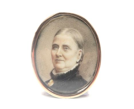 A VICTORIAN PORTRAIT MINIATURE&nbsp; Painted on ivory; the subject, an older lady in sombre (possibly mourning) dress, a gold