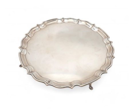 A GEORGE VI SILVER SALVER by Barker Brothers Ltd, Birmingham 1938, of circular form, with a chippendale pie crust rim, on thr