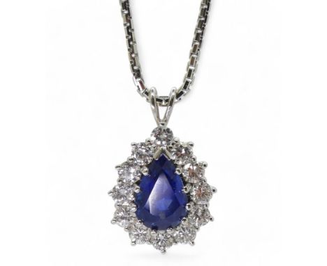 A SAPPHIRE & DIAMOND PENDANT  made in 18ct white gold, the sapphire measures approx 9mm x 6mm x 4.7mm, surrounded with brilli