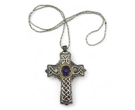 AN ARTS &amp; CRAFTS CELTIC CROSS the handmade white metal cross is hand chased with Celtic knotwork, with applied granulatio