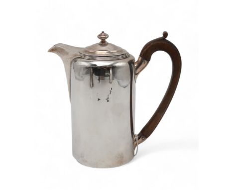 A GEORGE III SILVER HOT WATER POT by Robert Garrard I, London 1806, of plain cylindrical form, with a carved wooden handle an