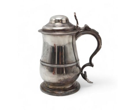 A GEORGE II LIDDED SILVER TANKARD by William Shaw II & William Priest, London 1756, of baluster form, with a vacant cartouche
