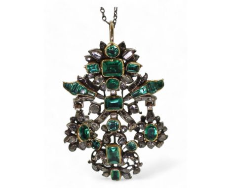 AN AUSTRO-HUNGARIAN JEWEL the yellow and white metal pendant, set with emeralds in yellow metal cut back settings and old cut