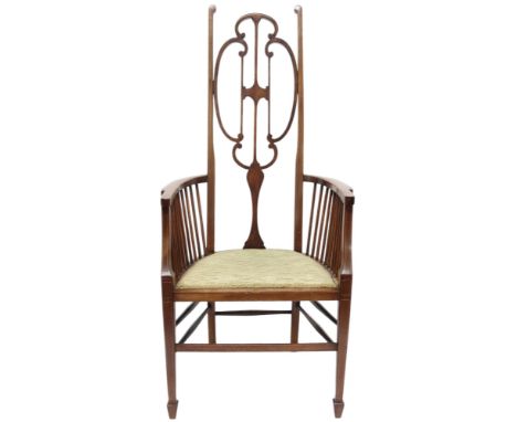 A 19TH CENTURY MAHOGANY LIBERTY STYLE HIGH BACK HALL CHAIR&nbsp; with stylized shaped backrest over upholstered seat flanked 