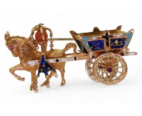 A HORSE & CART BROOCH made in 18k gold by Italian brand UnoAErre with enamel detail and further set with a coral bead and rub