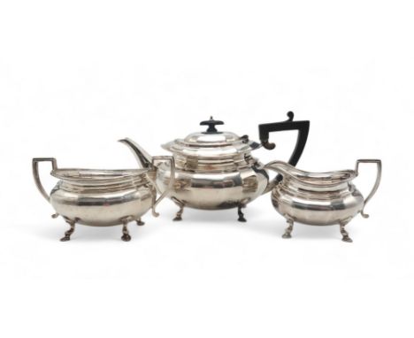 A GEORGE V BACHELORS SILVER TEA SERVICE Sheffield 1920, of faceted oval form, with ebonised handle and finial, with reeded ha