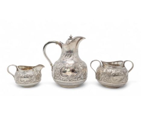 A LATE-VICTORIAN THREE PIECE SILVER TEA SERVICE by Martin Hall &amp; Co, Sheffield 1901, of swollen baluster form, chased and