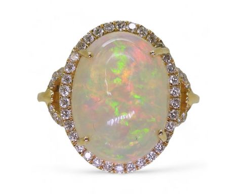 AN OPAL AND DIAMOND RING from the Illiana premier collection of GemsTV. Set with a substantial cabochon opal of 16mm x 12mm x
