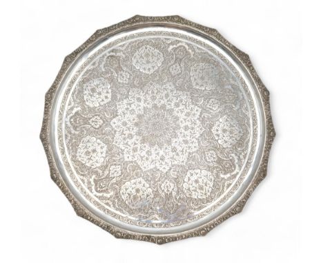 AN IRANIAN / PERSIAN SILVER DISH marked 84 with a maker's mark, of circular form, with engraved geometric foliate decoration 