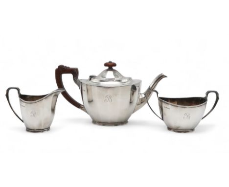 AN EDWARDIAN BACHELORS SILVER TEA SERVICE by William Suckling Ltd Birmingham 1938, of faceted form, engraved 'B', with carved