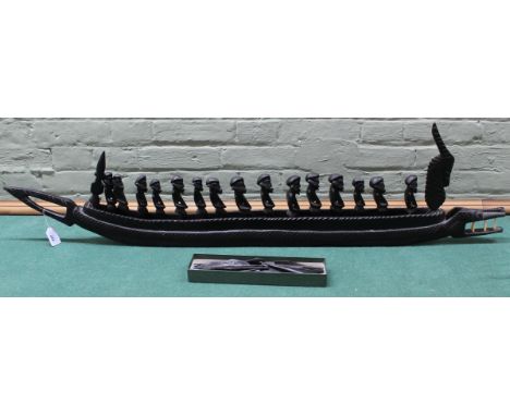 A large vintage (possibly Congolese) carved wooden crocodile war canoe with fifteen rowers, each with a paddle and spear, 132