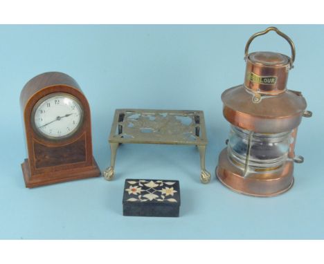 A copper 'bicolour' ships lamp, a wooden cased key wind mantel clock plus a brass trivet