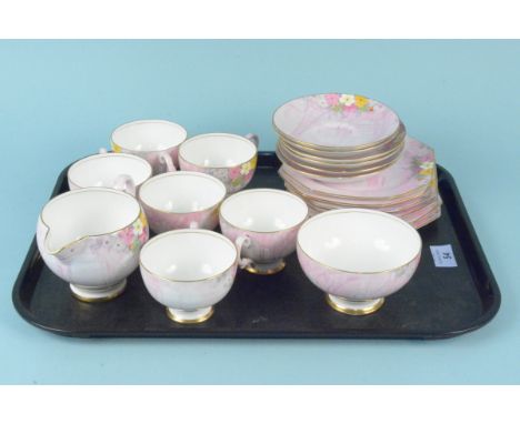 An Art Deco Paragon print and tint part tea set, six cups, saucers, plates, milk and sugar