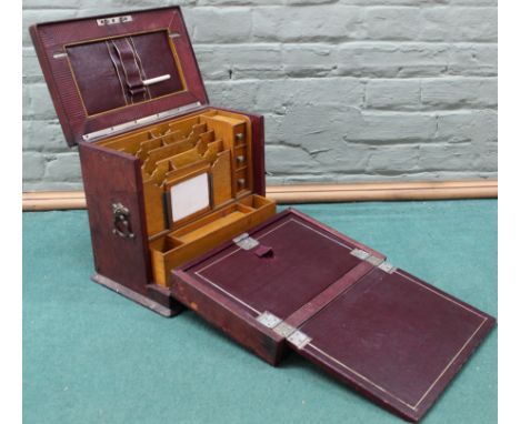 A vintage fold out travelling stationary box, wood interior with three small drawers, various compartments and writing slope 
