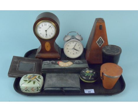 A mixed lot containing a metronome, a waisted mantel clock, a cloisonne lidded pot, two leather cased sets of drinking cups, 