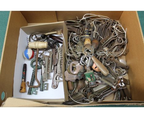 A large collection of vintage bottle openers