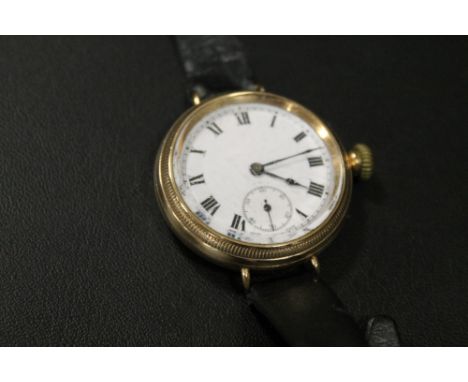 AN ANTIQUE MANUAL WIND WRISTWATCH - PROBABLY IN A GOLD CASE