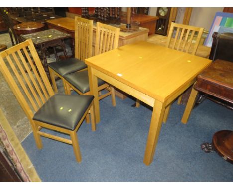 A MODERN LIGHT OAK FOLD-OVER KITCHEN TABLE AND FOUR CHAIRS