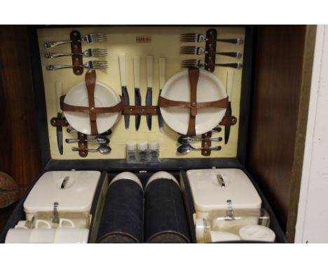 A SIRRAM VINTAGE BRIEFCASE STYLE PICNIC HAMPER AND CONTENTS