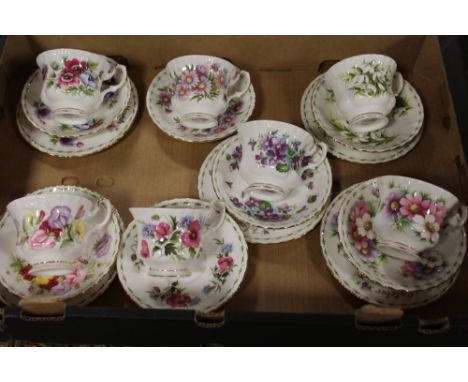 A TRAY OF ROYAL ALBERT FLOWERS OF THE MONTH CUPS AND SAUCERS - MARKED AS SECONDS