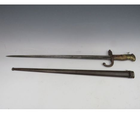 A 19TH CENTURY FRENCH BAYONET, in metal scabbard, inscribed on top edge of blade and dated 186, blade L 52 cm, overall L 66 c