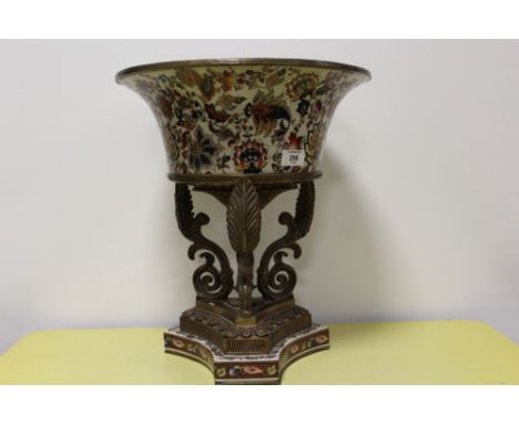 A LARGE AND IMPRESSIVE CONTINENTAL STYLE CERAMIC TABLE CENTREPIECE ON ACANTHUS SCROLL METAL BASE