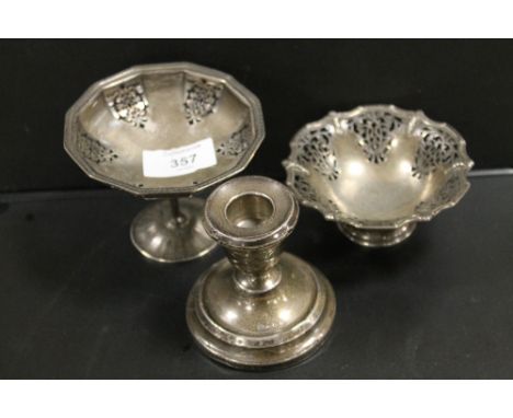 A HALLMARKED SILVER PIERCED BONBON DISH TOGETHER WITH ANOTHER PLUS A HALLMARKED SILVER SQUAT CANDLESTICK (3)