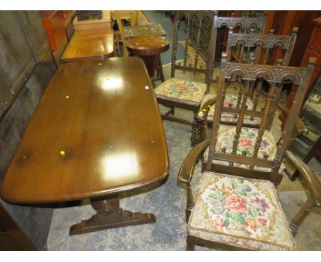 A DARK OAK ERCOL STYLE REFECTORY TABLE AND FOUR CHAIRS