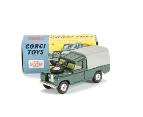 A Corgi Toys 438 Land Rover 109 WB, dark green body, grey plastic canopy, lemon interior, spun hubs, in original box, E, box 