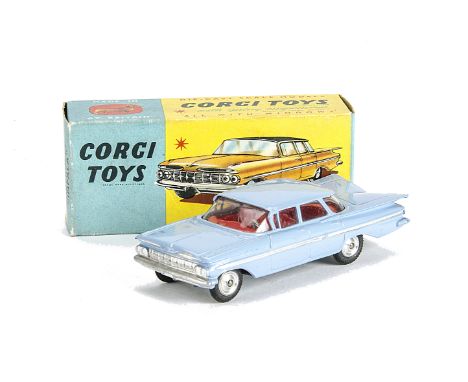 A Corgi Toys 220 Chevrolet Impala, powder blue body, red interior, spun hubs, in original box, E, box G