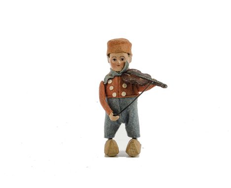 A Schuco tinplate clockwork ‘Dutch Boy’, playing the Violin, with clogs, VG, tested well at time of cataloguing