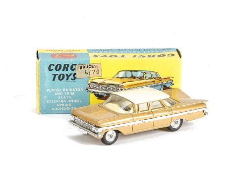 A Corgi Toys 248 Chevrolet Impala, light brown body, white roof, cream interior, spun hubs, in original box, E, box VG-E