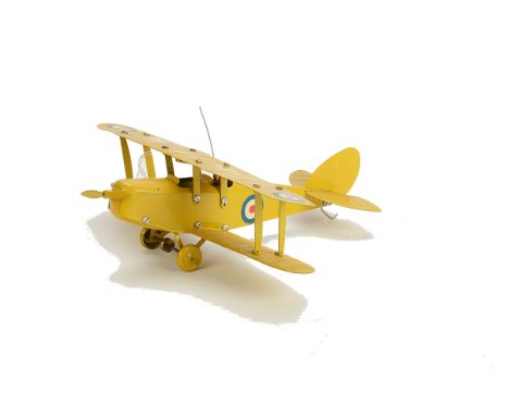 A Meccano No 0 Airplane Outfit Bi-plane, repainted all in yellow with RAF roundels, pilot in green with red helmet, G