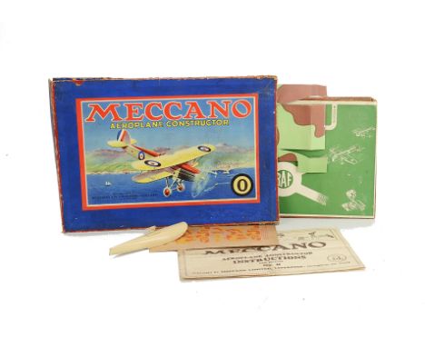 A Meccano No 0 Airplane Outfit Box with spare parts, a fair box with plain yellow card insert (no holes for stringing), one c