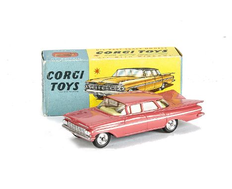 A Corgi Toys 220 Chevrolet Impala, pink body, lemon interior, spun hubs, in original box, E, box G