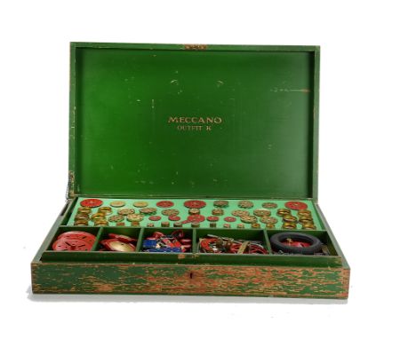 A Meccano Outfit K including digger bucket, straight funnels, pulleys, roller bearing cage, contents from mix of periods, in 